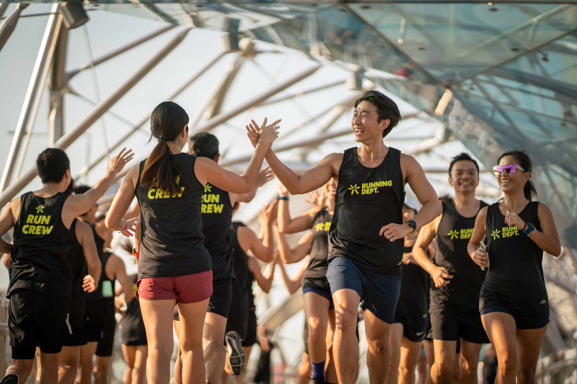 Running Department crew members celebrating together after a run